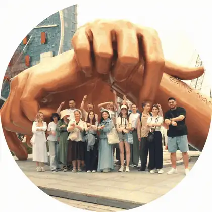 Tour group in front of the Gangnam Style hands sculpture in Seoul