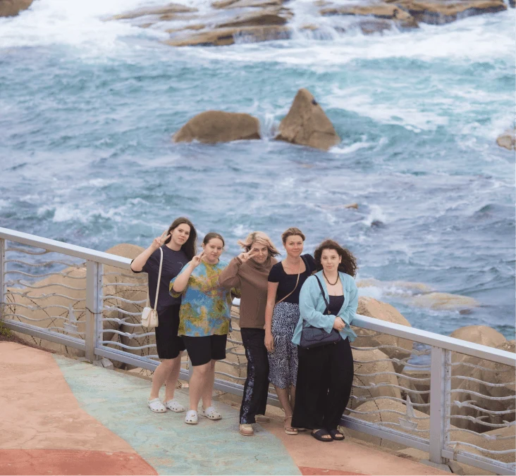 A group of travelers on a seaside boardwalk
