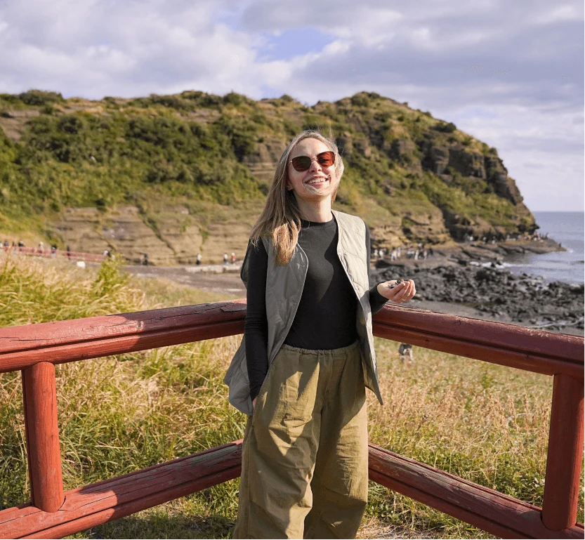 A traveler on the seashore by the cliffs