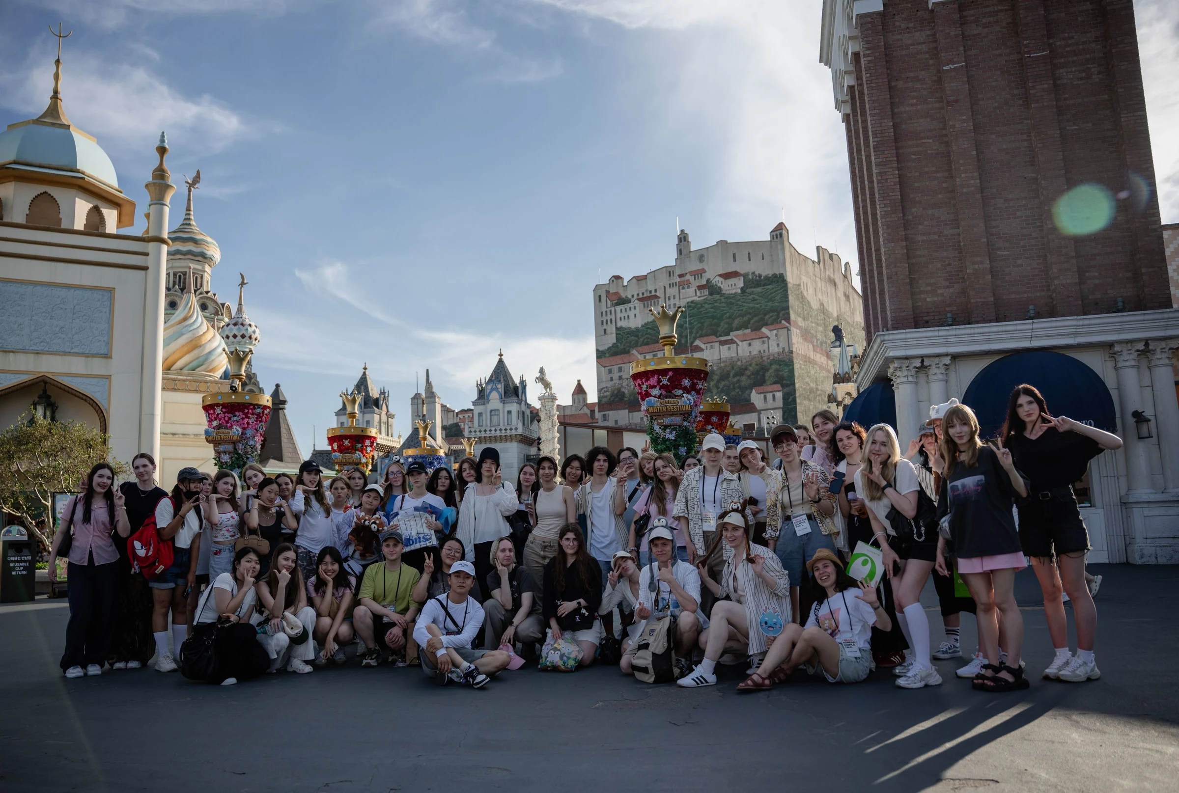 A group of tourists near themed buildings