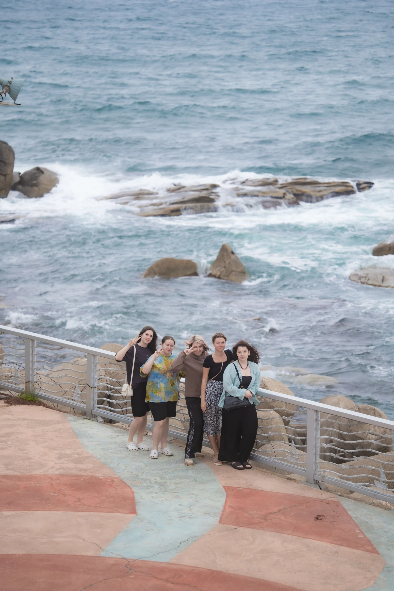 A group of travelers on a seaside boardwalk