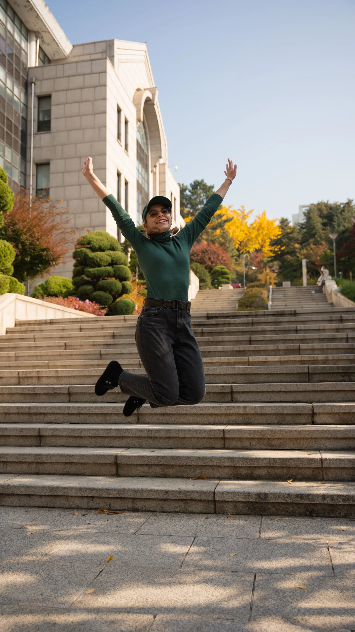 Tourist jumping on steps